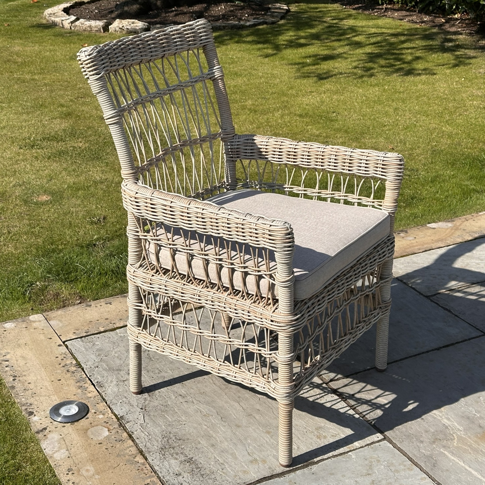 Wicker weave garden outdoor dining chair weather resistant durability against the elements year round outdoor placement low maintenance care aluminium frame light weight sturdy rust protection quick drying polyester cushions resists moisture and UV damage